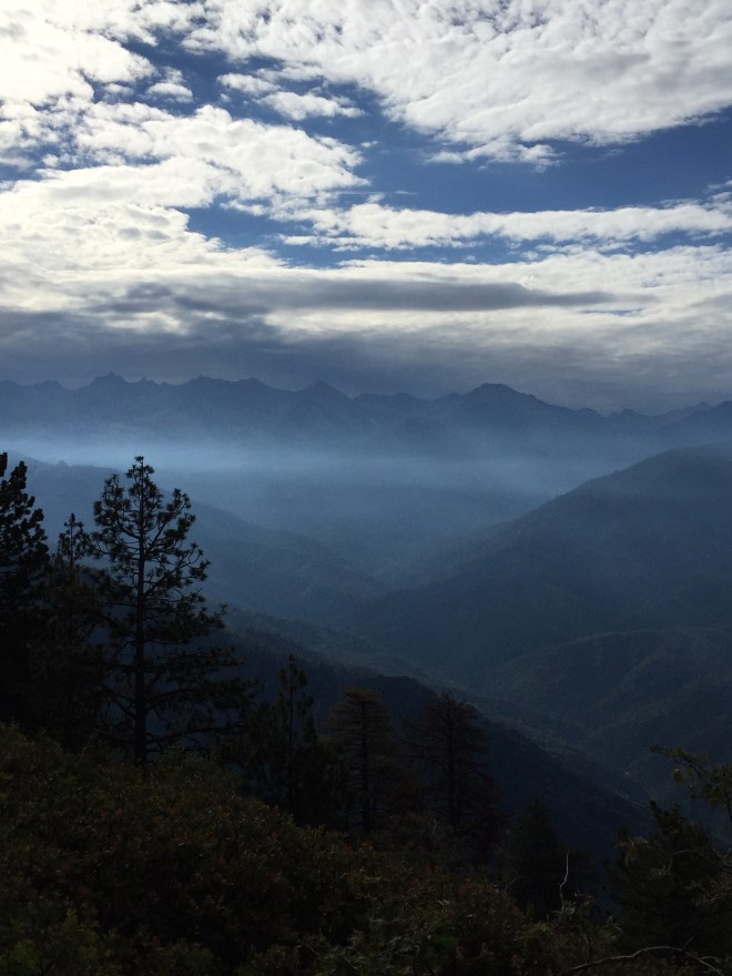 Civilization encroaches in the shape of a floating band of smog.